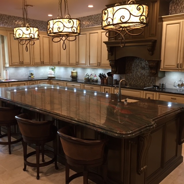 Eat-in kitchen - mid-sized transitional u-shaped ceramic tile and beige floor eat-in kitchen idea in Austin with a double-bowl sink, raised-panel cabinets, light wood cabinets, concrete countertops, gray backsplash, ceramic backsplash, stainless steel appliances and an island