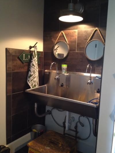 Mid-sized mountain style mudroom photo in Philadelphia with beige walls and a white front door