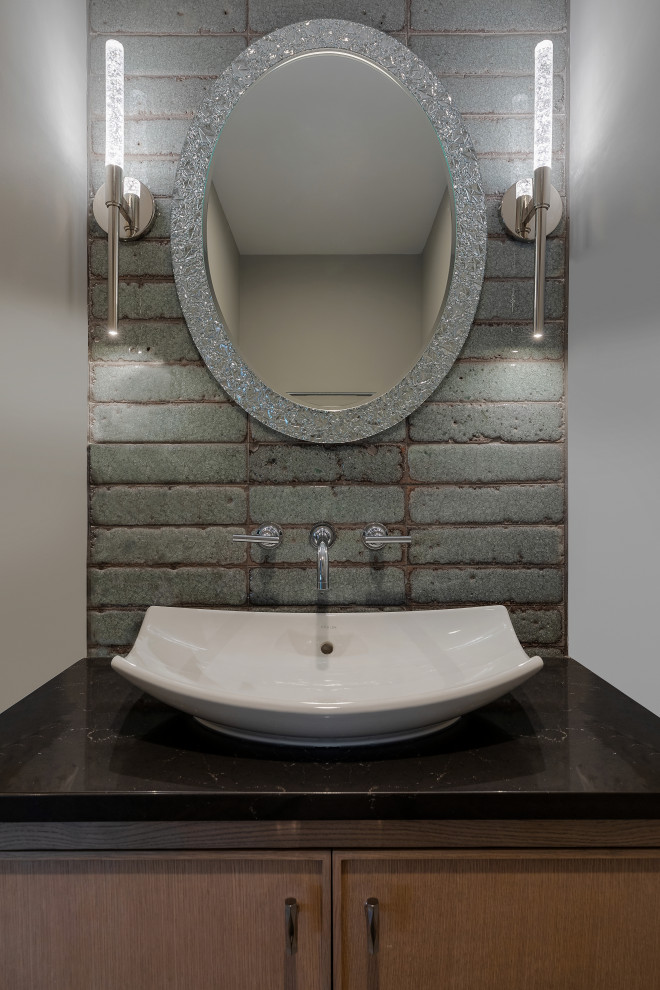 Photo of a small traditional cloakroom in New York with beaded cabinets, medium wood cabinets, a wall mounted toilet, blue tiles, ceramic tiles, grey walls, light hardwood flooring, a vessel sink, engineered stone worktops, brown worktops and a floating vanity unit.