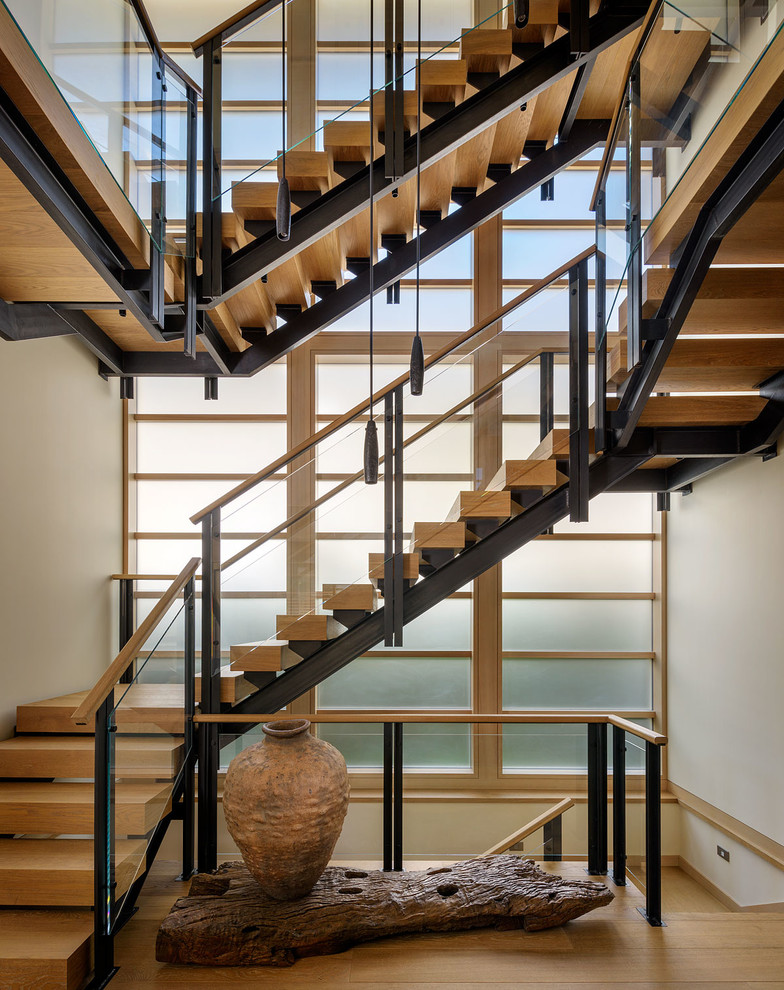 Photo of an asian wood u-shaped staircase in Seattle with open risers.