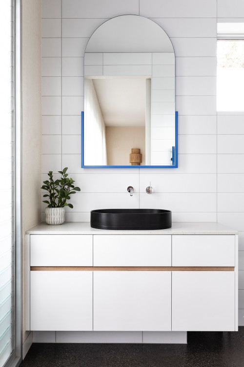 Serene Elegance: A Pop of Blue and White Porcelain Tile Backsplash for Your Bathroom Vanity with White Tops