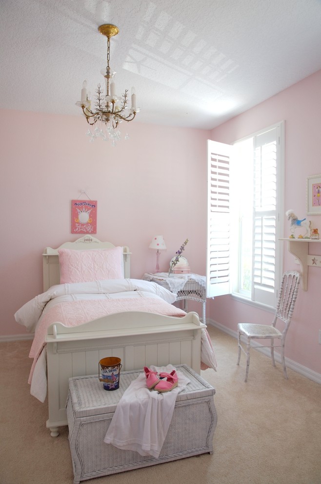 Design ideas for a mid-sized beach style kids' bedroom for kids 4-10 years old and girls in Tampa with pink walls, carpet and beige floor.