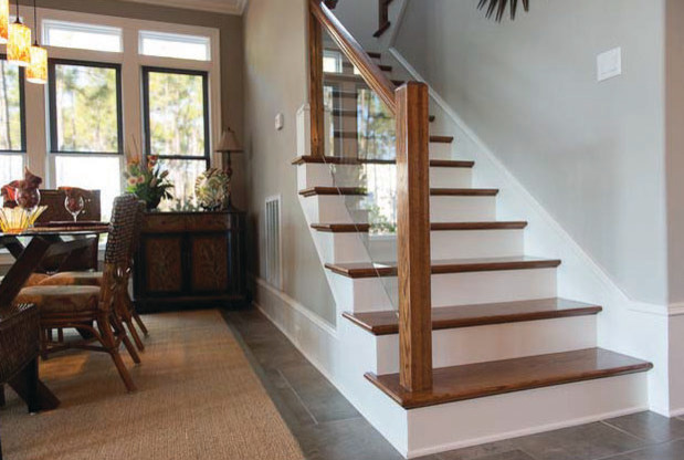 Staircase - large transitional wooden u-shaped staircase idea in Charlotte with painted risers