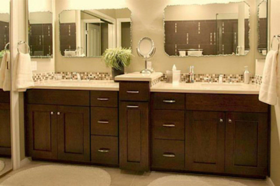 Transitional brown tile bathroom photo in Phoenix with a vessel sink, raised-panel cabinets, medium tone wood cabinets and white walls