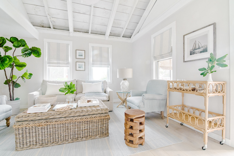 Inspiration for a small beach style open concept living room in Providence with beige walls, light hardwood floors and beige floor.