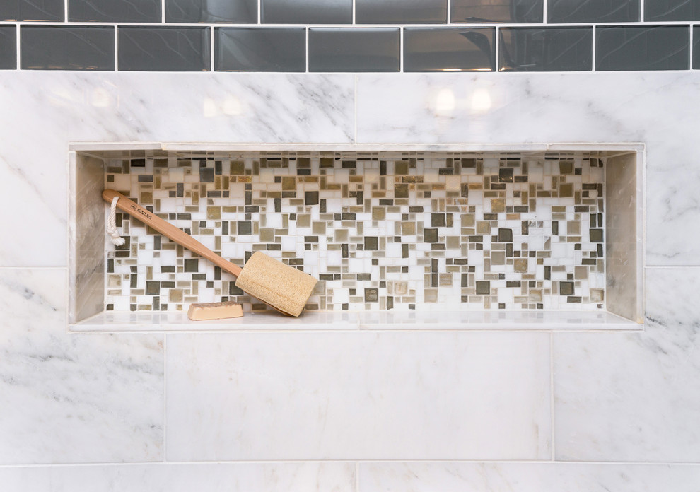 Mid-sized transitional master gray tile and mosaic tile marble floor home design photo with an undermount sink, recessed-panel cabinets, dark wood cabinets, quartzite countertops, a one-piece toilet and gray walls