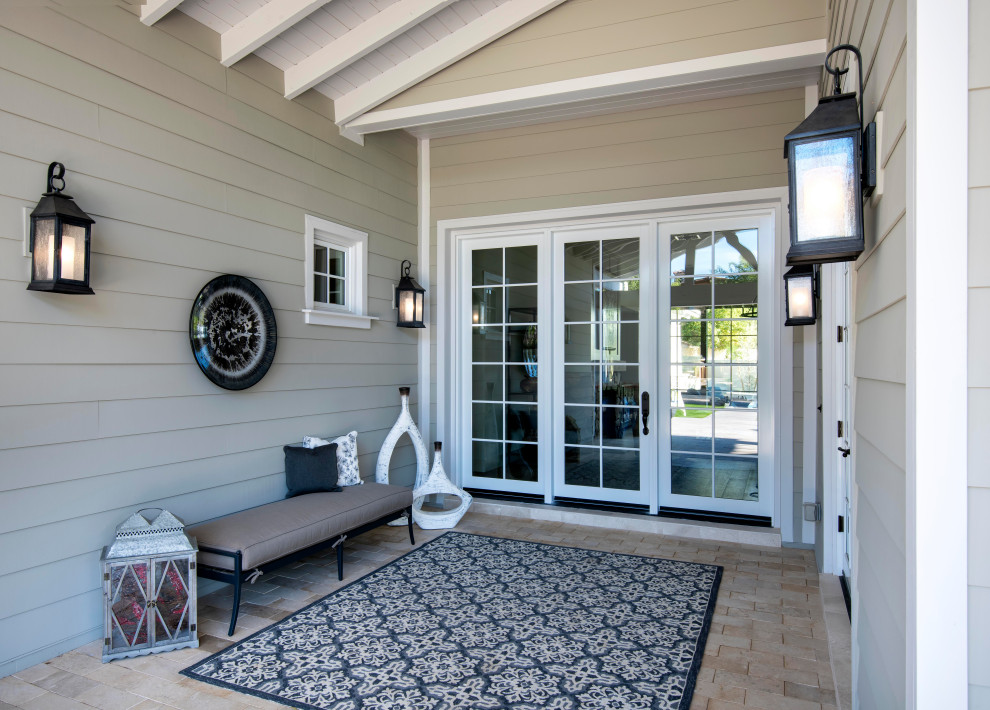 Transitional beige floor front door photo in Phoenix with beige walls and a glass front door