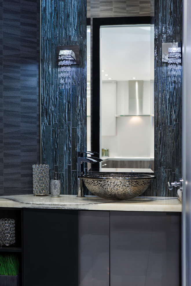 Photo of a mid-sized transitional powder room in Miami with flat-panel cabinets, grey cabinets, gray tile, matchstick tile, white walls, marble floors, a vessel sink and engineered quartz benchtops.