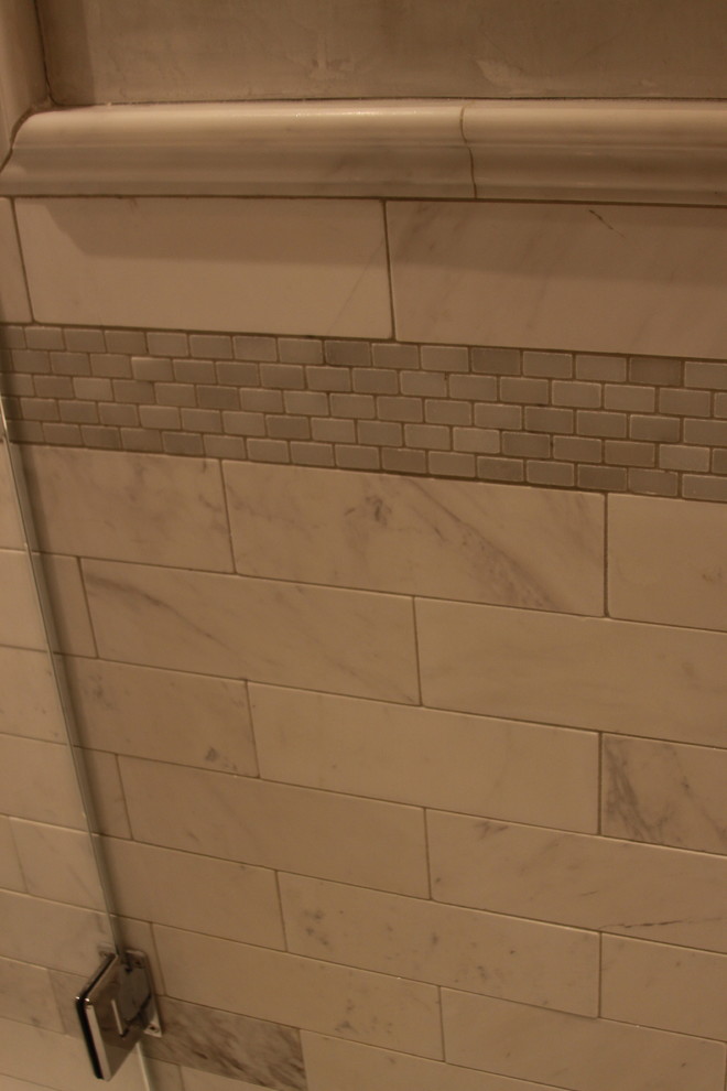 Example of a mid-sized transitional master multicolored tile and stone tile marble floor freestanding bathtub design in Atlanta with a vessel sink, beaded inset cabinets, beige cabinets, marble countertops, a one-piece toilet and gray walls