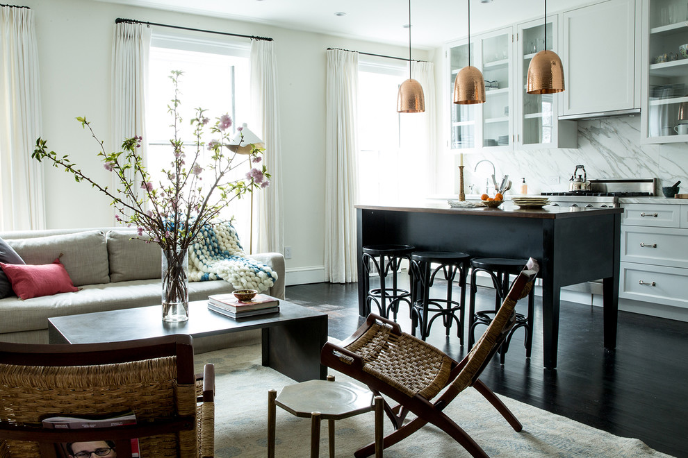 Mid-sized transitional l-shaped dark wood floor open concept kitchen photo in New York with white backsplash, an island, an undermount sink, shaker cabinets, white cabinets, wood countertops, stainless steel appliances and marble backsplash