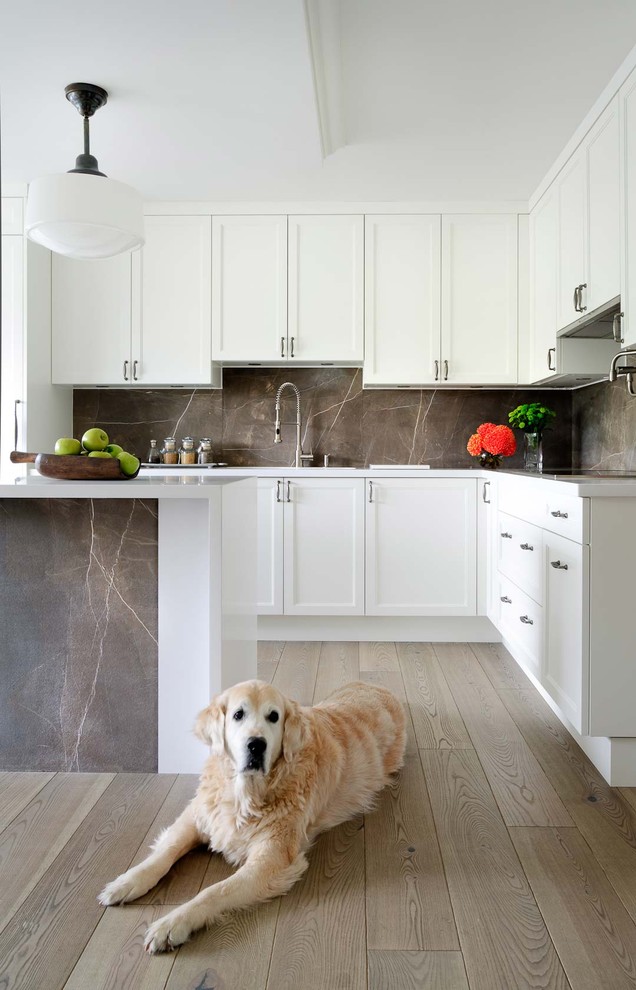 Design ideas for a transitional kitchen in Toronto with stone slab splashback.