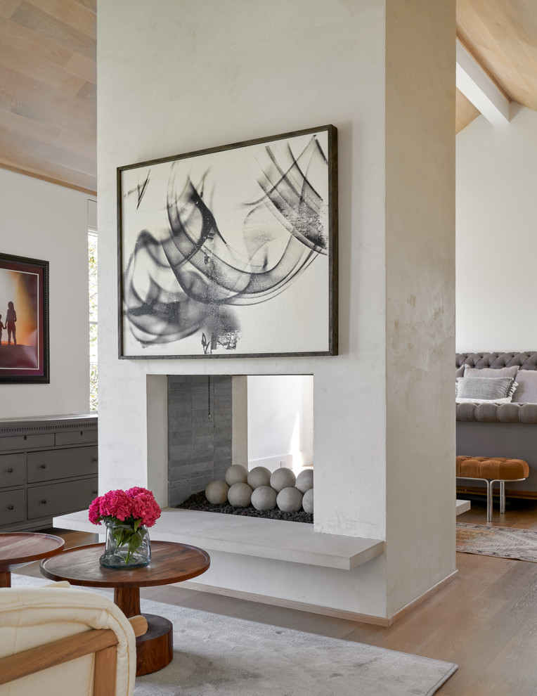 Beverly | 2018 - Bedroom - mid-sized transitional master medium tone wood floor and brown floor bedroom idea in Dallas with white walls, a two-sided fireplace and a tile fireplace