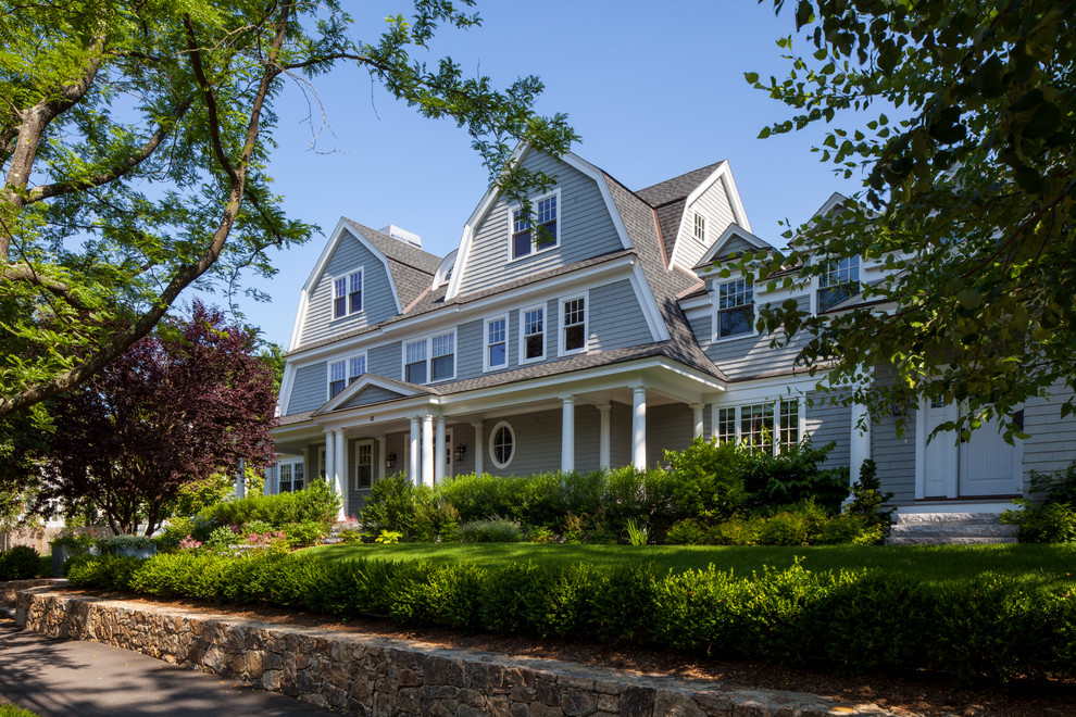 Mid-sized traditional three-storey grey exterior in Boston with wood siding and a gambrel roof.