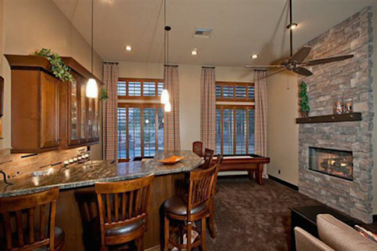 Home design - transitional home design idea in Phoenix with white walls, a standard fireplace and a stone fireplace