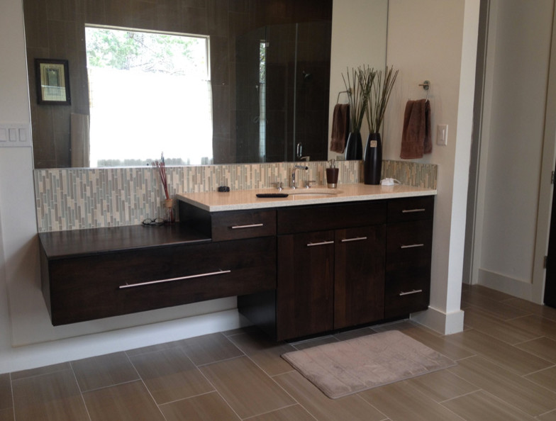 Inspiration for a transitional beige tile bathroom remodel in Austin with raised-panel cabinets and medium tone wood cabinets