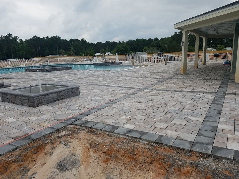 Hot tub - large transitional backyard stone and custom-shaped natural hot tub idea in Miami