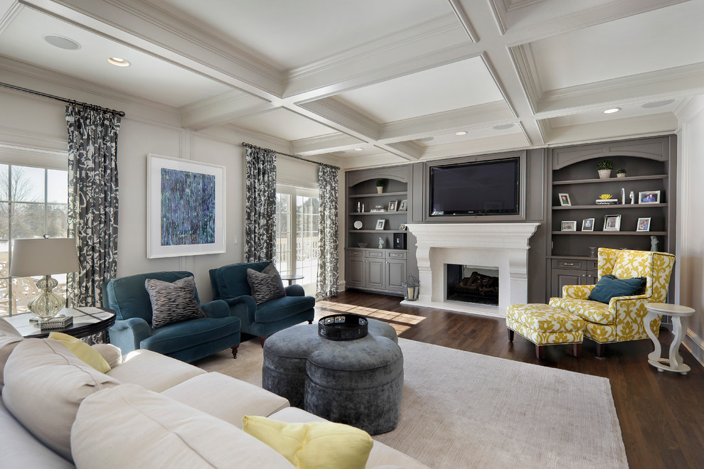 Mid-sized transitional formal enclosed living room in Chicago with white walls, medium hardwood floors, a standard fireplace, a plaster fireplace surround and a built-in media wall.