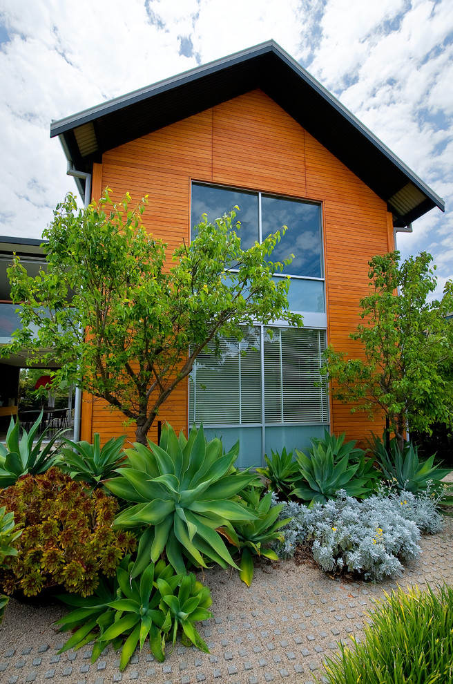 Inspiration for a contemporary exterior in Perth with wood siding.