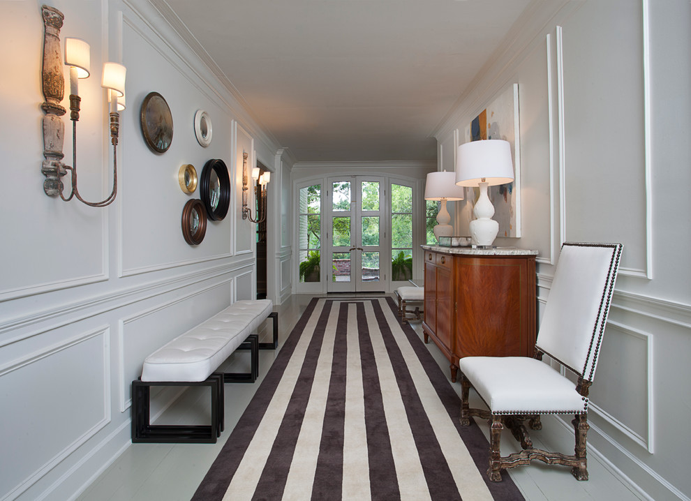 This is an example of a transitional hallway in New Orleans with white walls.