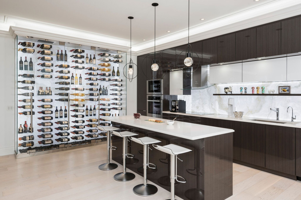 Mid-sized contemporary l-shaped kitchen pantry in Toronto with an undermount sink, flat-panel cabinets, brown cabinets, quartz benchtops, white splashback, stone slab splashback, stainless steel appliances, light hardwood floors, with island, beige floor, white benchtop and coffered.