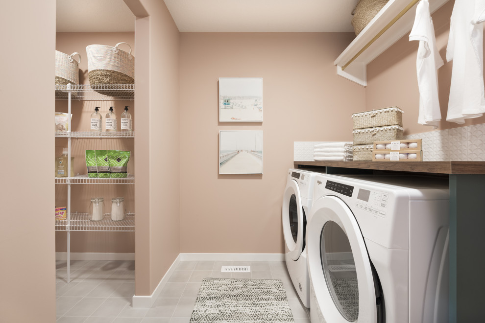 Design ideas for a tropical laundry room in Calgary.