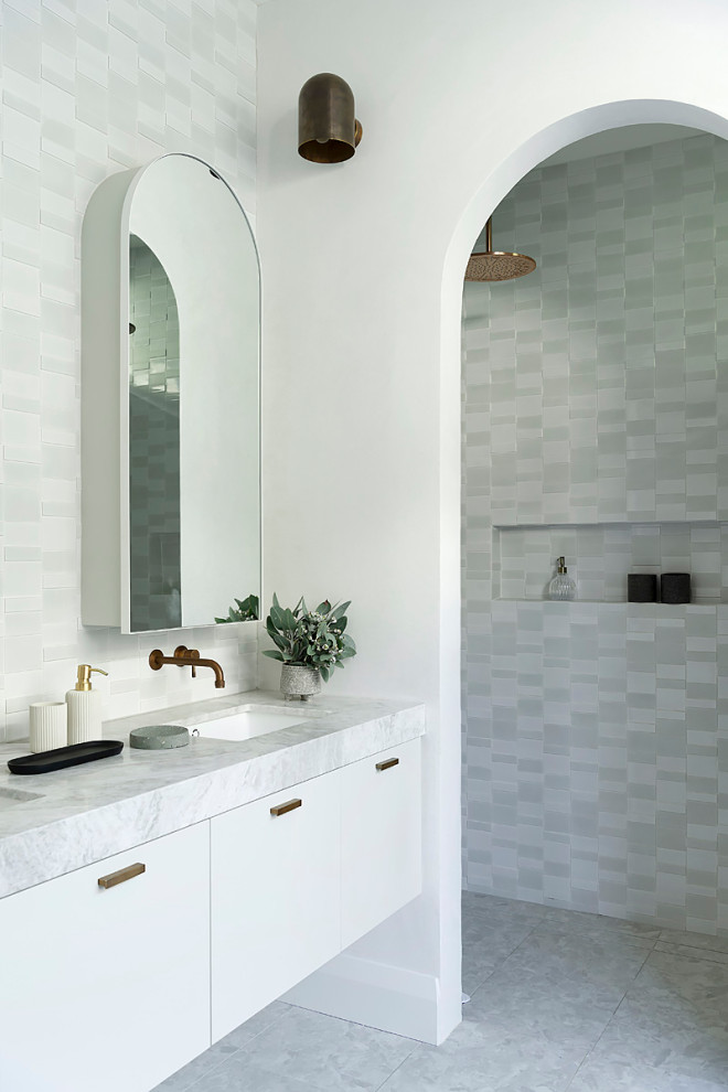 Inspiration for a large contemporary 3/4 bathroom in Perth with a freestanding tub, white walls, cement tiles, engineered quartz benchtops, grey floor, a single vanity, a floating vanity, flat-panel cabinets, white cabinets, an alcove shower, gray tile, an undermount sink, an open shower and grey benchtops.