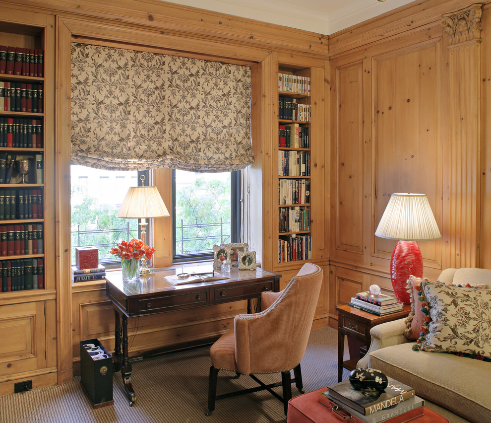 Inspiration for a traditional family room in New York with a library, beige walls and no tv.