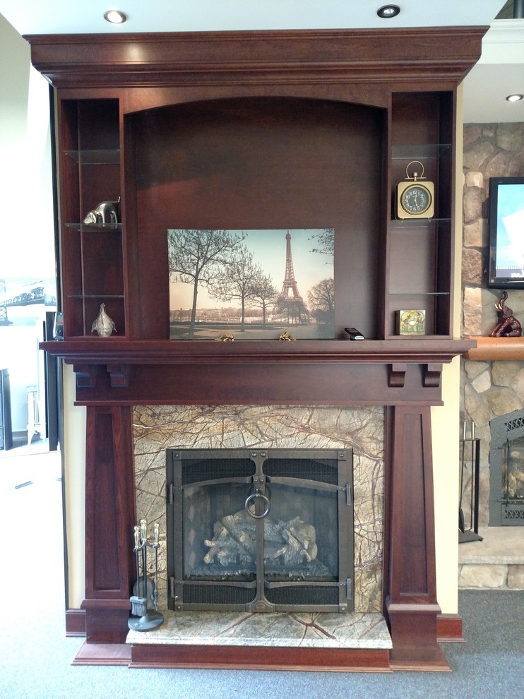 Photo of a country family room in New York with a standard fireplace, beige walls, carpet, a stone fireplace surround and a wall-mounted tv.