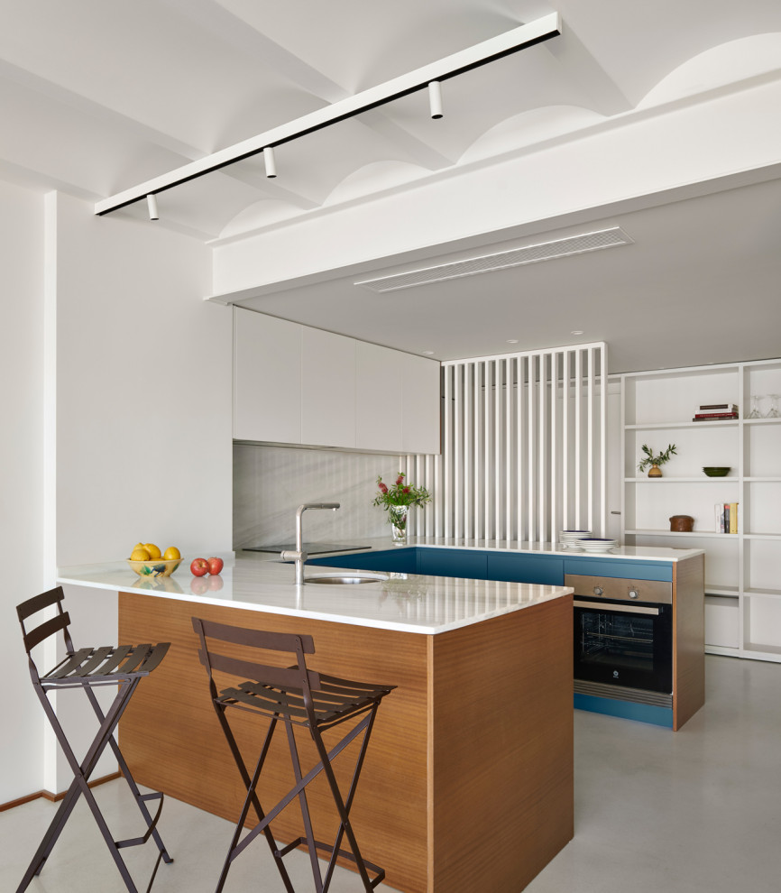 Design ideas for a mediterranean kitchen with concrete flooring.