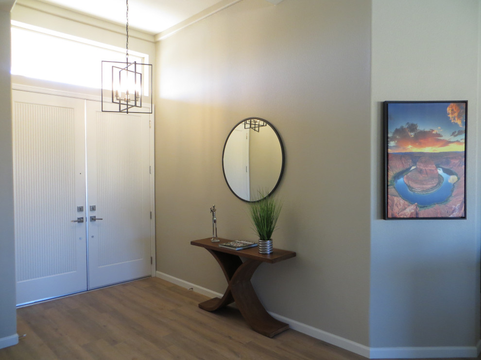 Example of a mid-sized transitional porcelain tile and beige floor double front door design in Phoenix with beige walls and a white front door