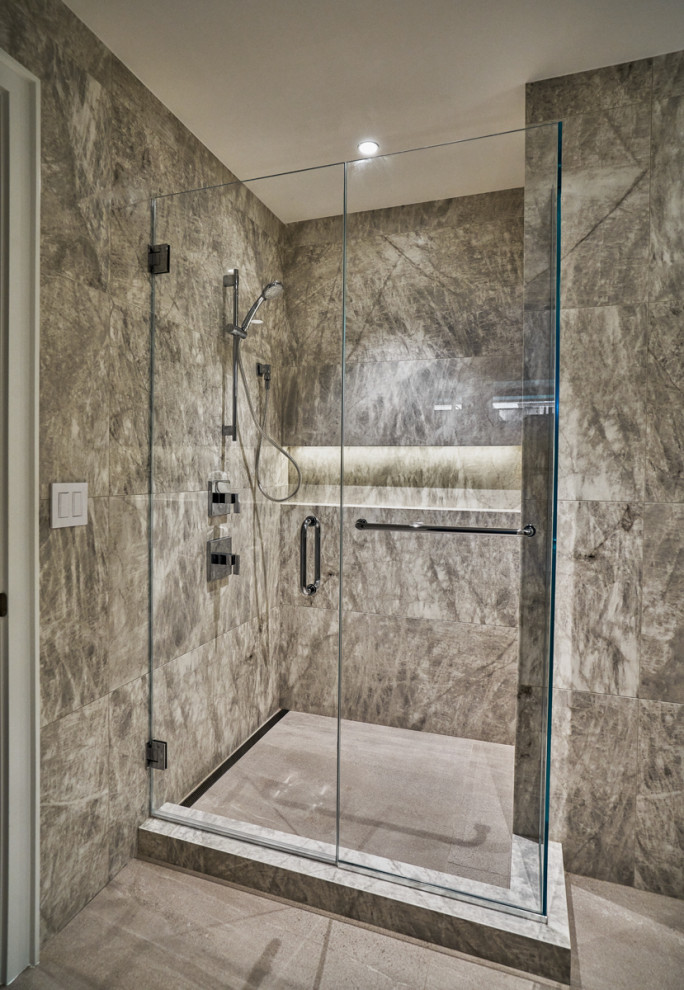 Design ideas for a mid-sized modern bathroom in Chicago with glass-front cabinets, dark wood cabinets, an alcove shower, a one-piece toilet, white tile, porcelain tile, porcelain floors, an undermount sink, beige floor, a hinged shower door, white benchtops, a niche, a single vanity, a floating vanity and marble benchtops.