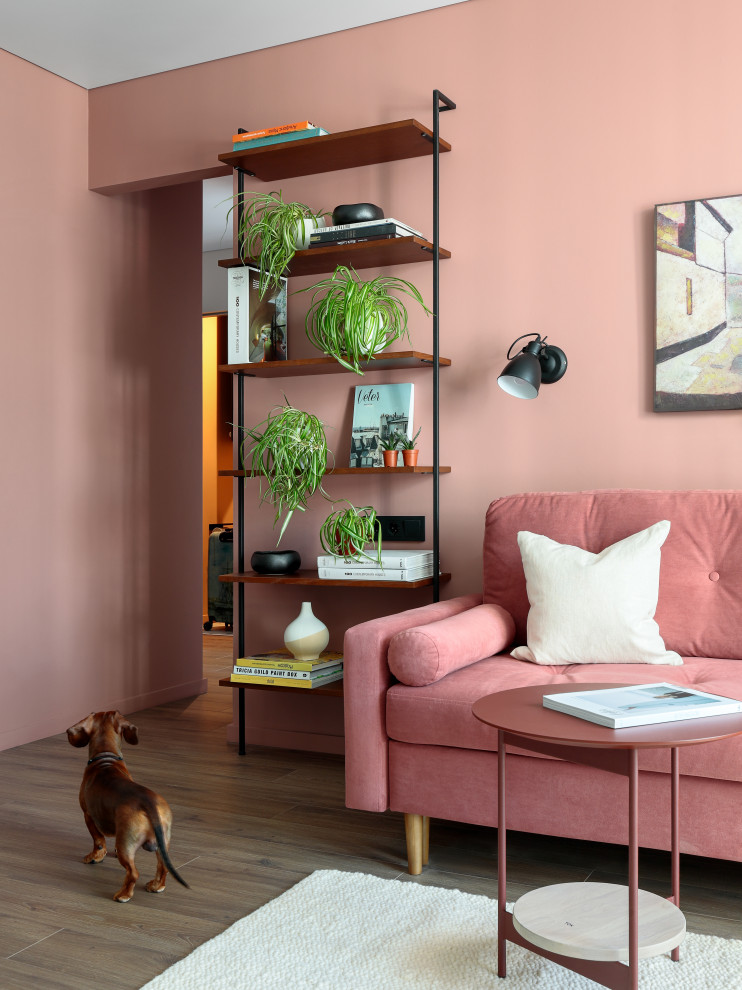 Photo of a mid-sized scandinavian living room in Saint Petersburg with pink walls, medium hardwood floors and brown floor.