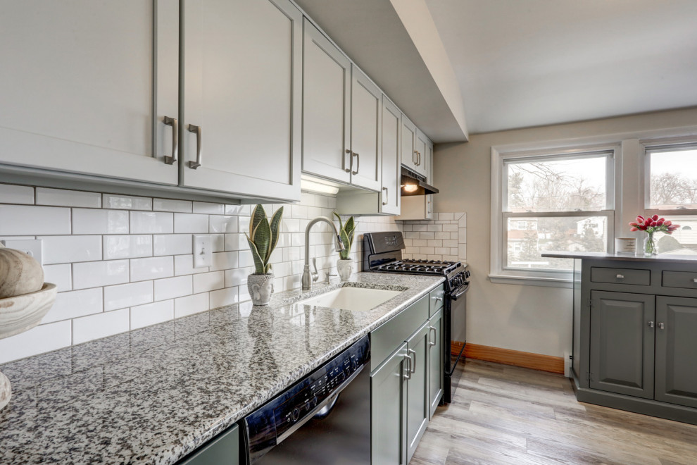 Mid-sized transitional l-shaped eat-in kitchen photo with recessed-panel cabinets, green cabinets and a peninsula