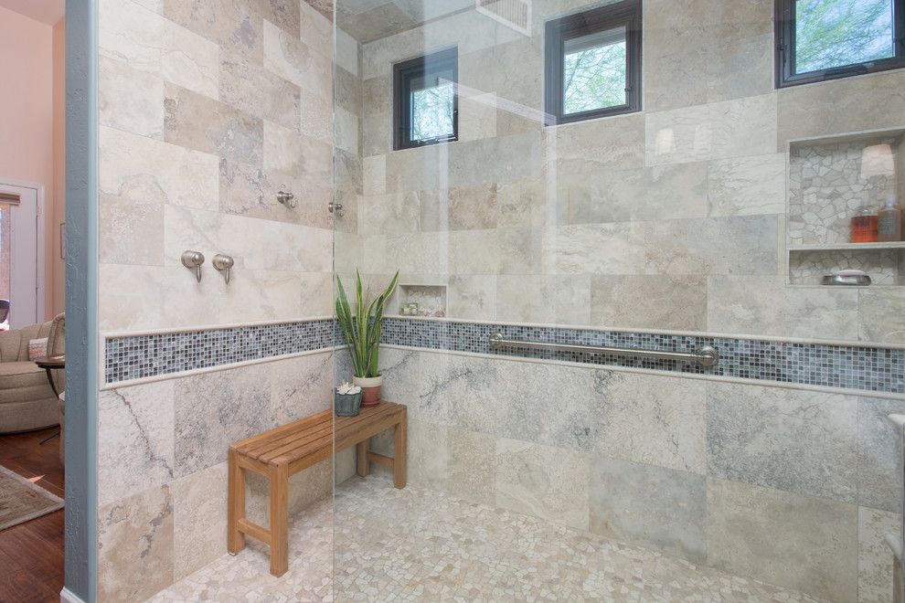 Example of a large transitional master gray tile and stone tile ceramic tile walk-in shower design in Phoenix with an undermount sink, raised-panel cabinets, dark wood cabinets, granite countertops and blue walls