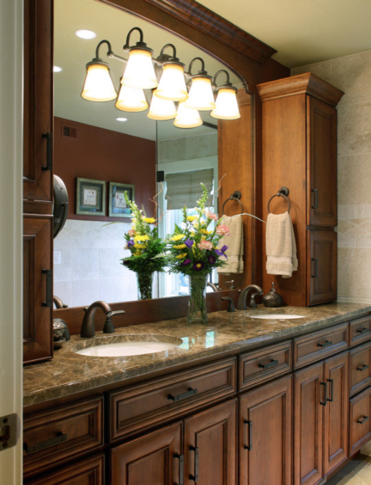 Inspiration for a large transitional master bathroom remodel with raised-panel cabinets, medium tone wood cabinets and an undermount sink