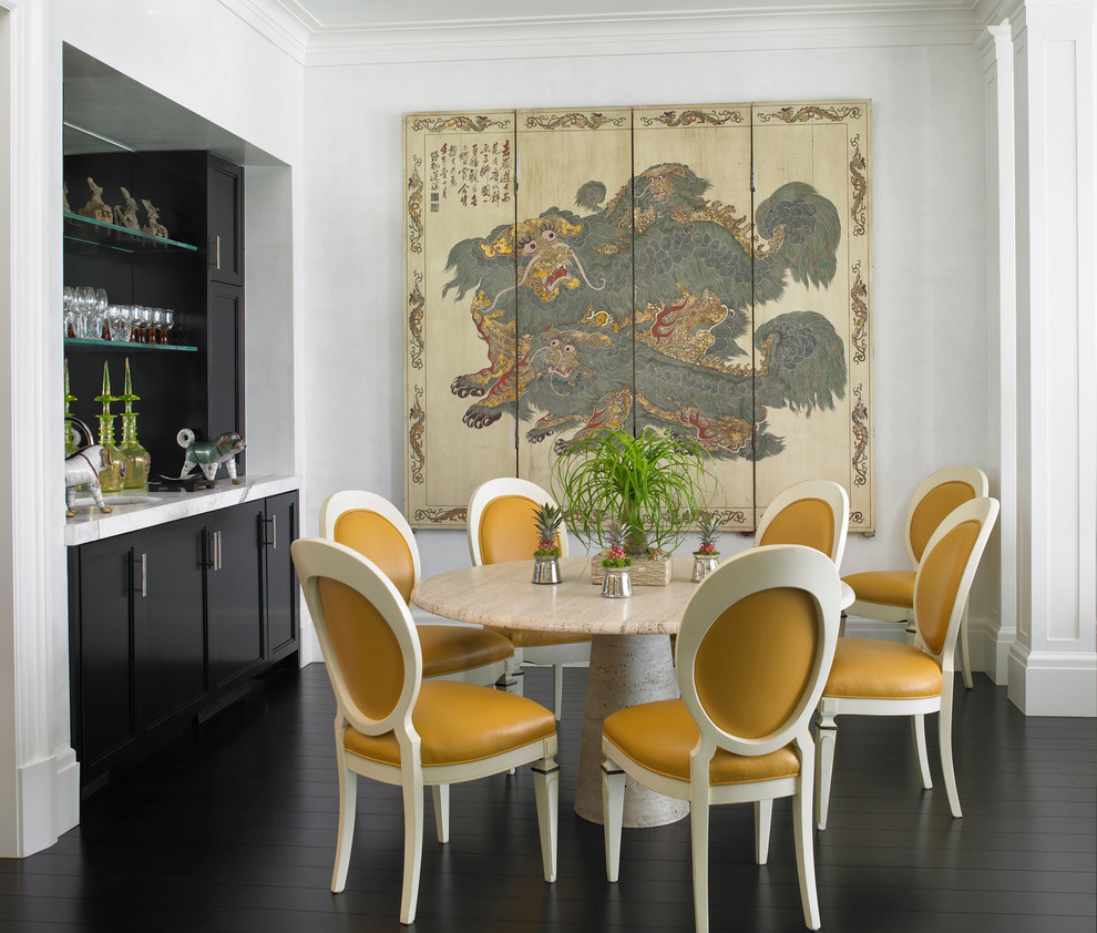 Inspiration for an asian dining room in Miami with white walls and dark hardwood floors.
