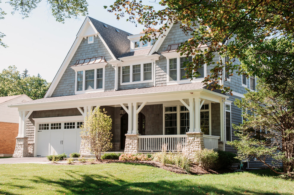 Example of a mid-sized classic blue two-story mixed siding exterior home design in Chicago