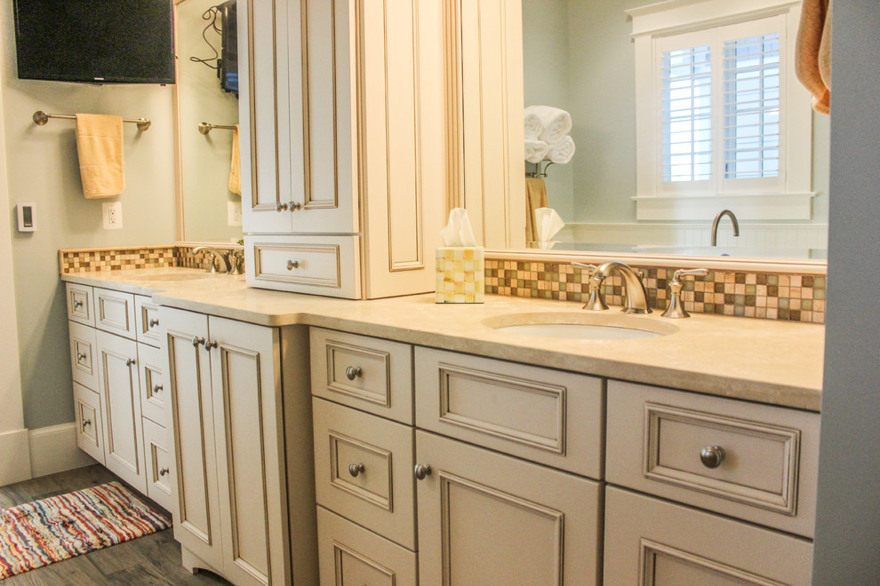 Large traditional master bathroom in DC Metro with raised-panel cabinets.