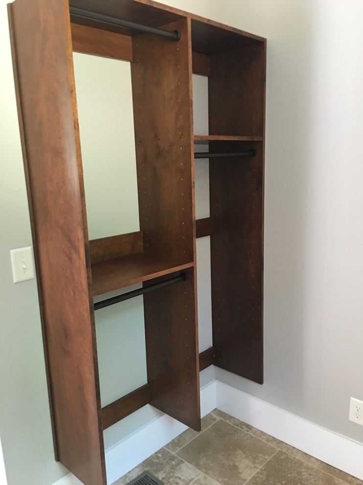 Photo of a small transitional single-wall laundry cupboard in Atlanta with an undermount sink, open cabinets, medium wood cabinets, grey walls and a side-by-side washer and dryer.