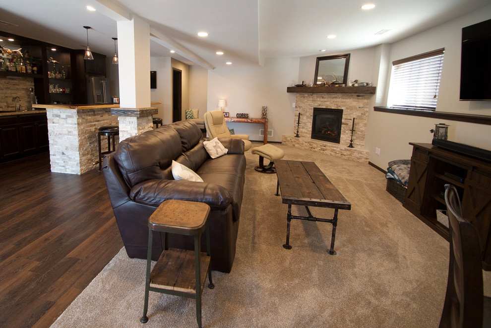 Mountain style carpeted and beige floor basement photo with a corner fireplace
