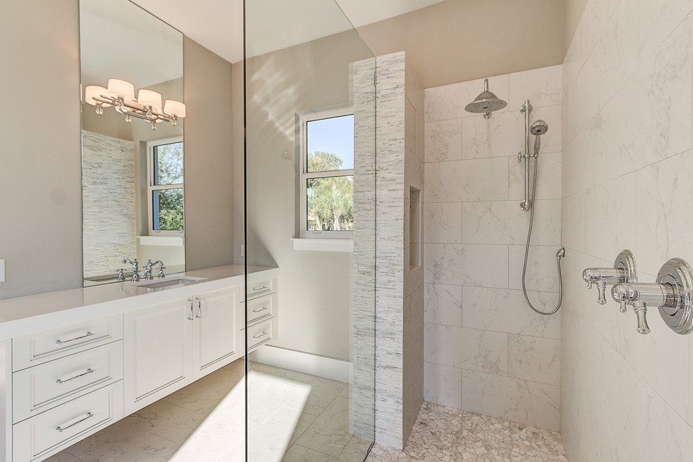 Large transitional master bathroom in Tampa with recessed-panel cabinets, white cabinets, an open shower, gray tile, marble, grey walls, marble floors, an undermount sink, engineered quartz benchtops, grey floor and an open shower.