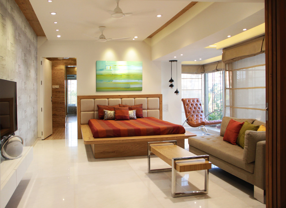 This is an example of a mid-sized contemporary bedroom in Mumbai with white walls, ceramic floors and beige floor.