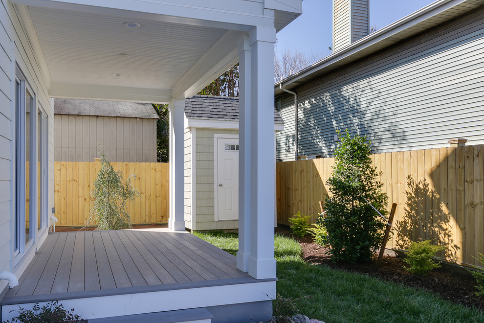 Photo of a mid-sized beach style side yard verandah in Other with decking and a roof extension.