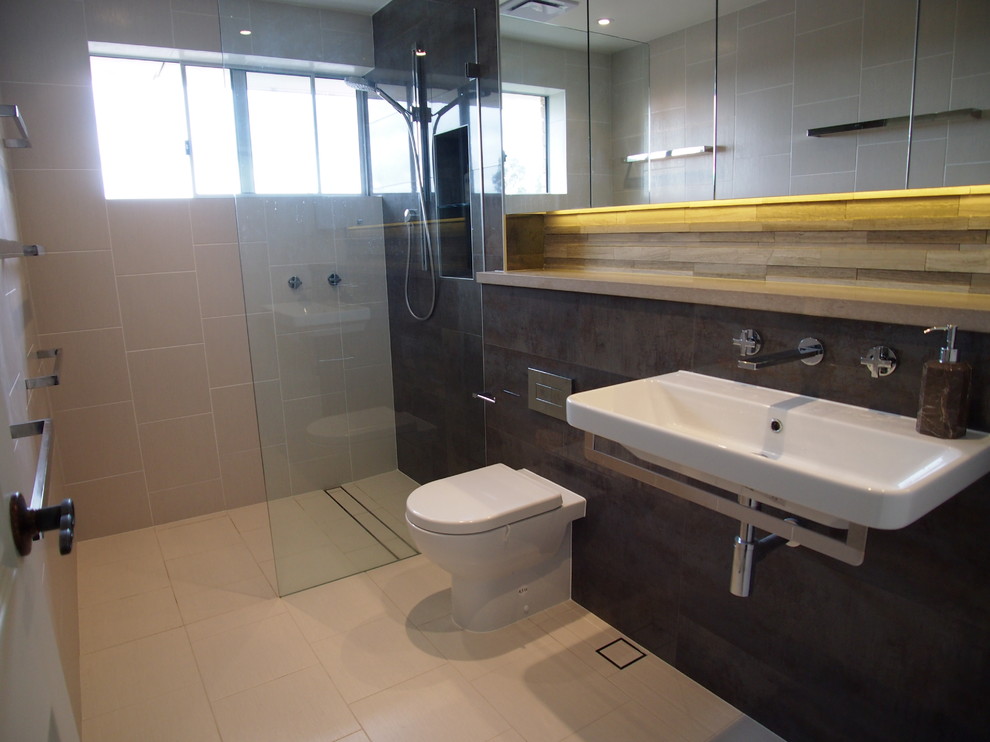 Photo of a contemporary bathroom in Other with engineered quartz benchtops, gray tile and grey walls.