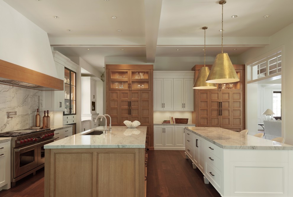 Inspiration for a large transitional galley eat-in kitchen in Miami with an undermount sink, shaker cabinets, light wood cabinets, granite benchtops, stone slab splashback, panelled appliances, dark hardwood floors and multiple islands.