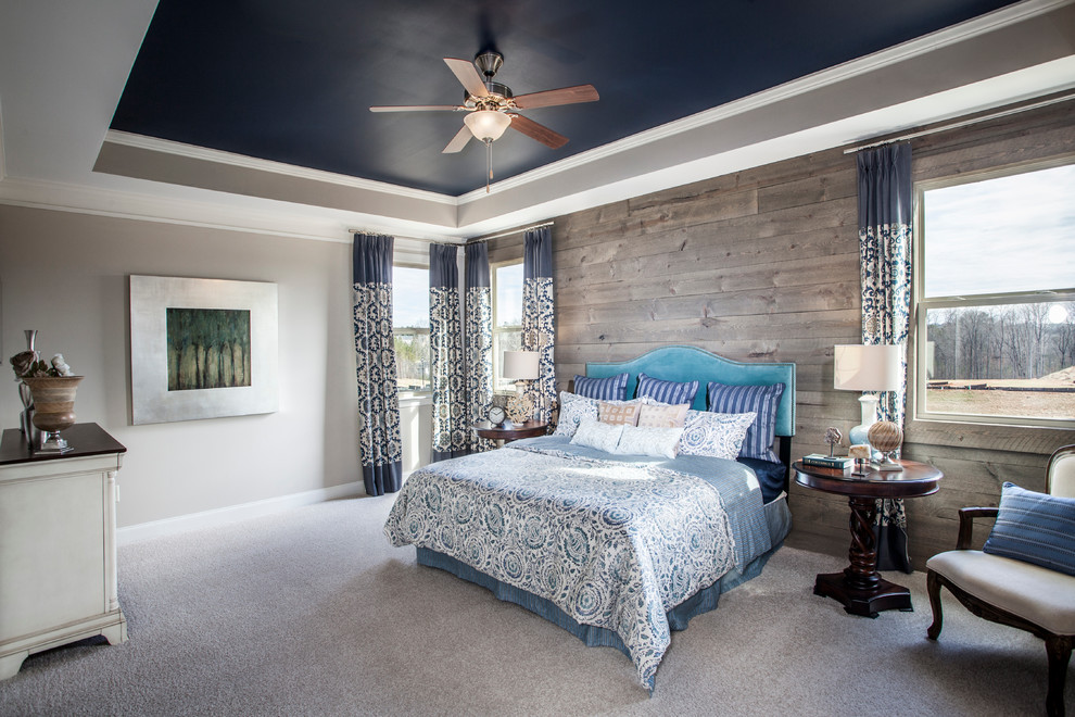 Design ideas for a country master bedroom in Atlanta with beige walls and carpet.