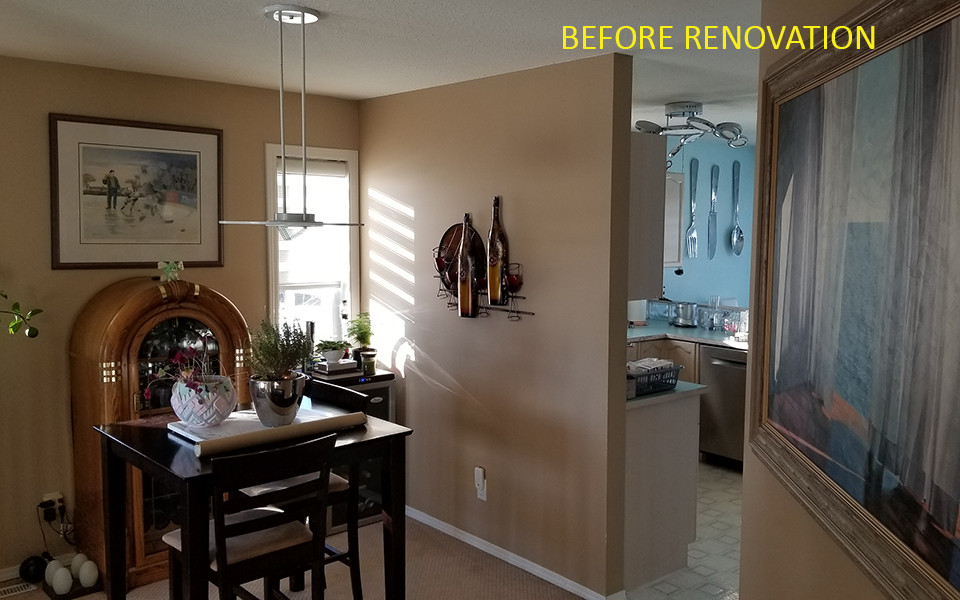 Kitchen - mid-sized transitional galley vinyl floor and brown floor kitchen idea in Calgary with an undermount sink, shaker cabinets, white cabinets, quartz countertops, white backsplash, porcelain backsplash, stainless steel appliances, an island and white countertops