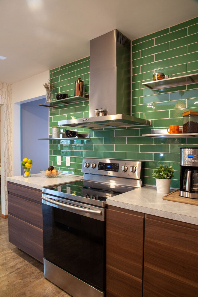 This is an example of a mid-sized modern kitchen in Other with an undermount sink, flat-panel cabinets, medium wood cabinets, laminate benchtops, green splashback, glass tile splashback, stainless steel appliances, vinyl floors, with island, brown floor and white benchtop.