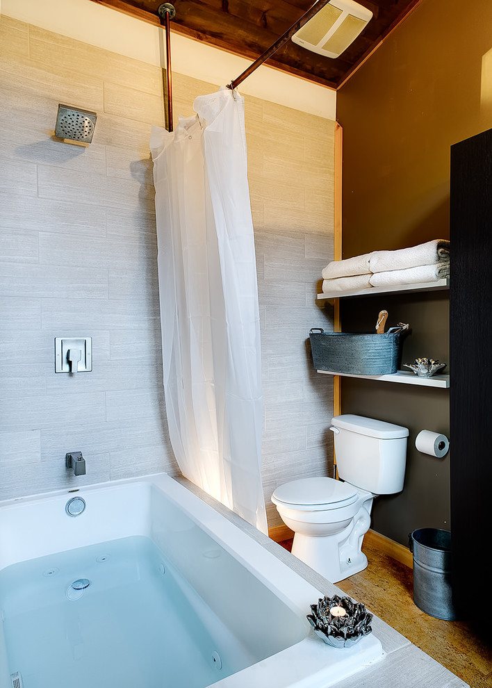 Design ideas for a large country master bathroom in New York with flat-panel cabinets, dark wood cabinets, a drop-in tub, a shower/bathtub combo, a one-piece toilet, white tile, ceramic tile, brown walls, bamboo floors, a wall-mount sink, concrete benchtops and brown floor.
