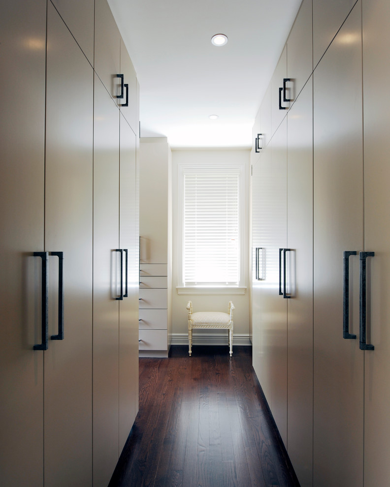 Inspiration for a contemporary walk-in wardrobe in Toronto with flat-panel cabinets and beige cabinets.